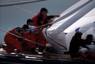 The crew of J Class yacht Endeavour battle to bring in the huge spinnaker
