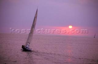 Sailing yacht in the sunset or sunrise