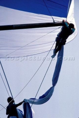 Bowman at the end of a spinnaker pole