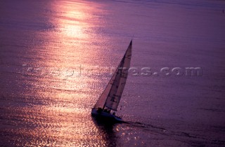 Racing yacht at sunset
