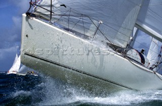 The bow of a Beneteau racing yacht rising out of the water - Spi Ouest Race Week, France