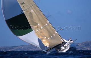 Maxi Sled Morning Glory reaching with spinnaker in strong breeze.