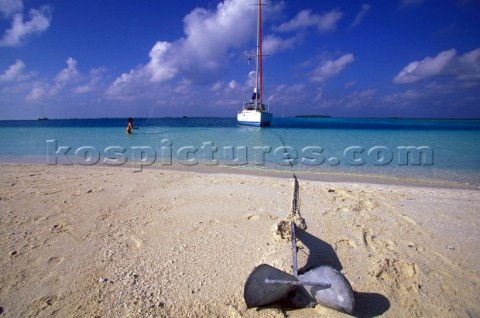 Anchor on sandy beach Maldives