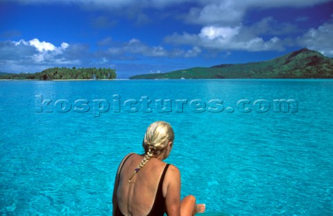 Girl sitting on beach  French Polynesia