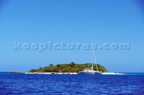 Catamaran anchored off remote Polynesian island