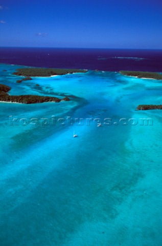 Bright turquoise blue water in the sandy bays and reefs and shoals of the best cruising areas of New