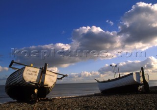 Two fishing boats on the shingle at Dunwich Beach, Suffolk, UK