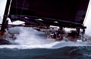 Spray over deck of sailing yacht in rough seas