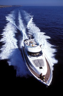 Fairline power boat speeding over calm sea