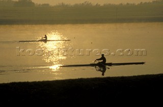 Two scullers racing on the river Thames. UK