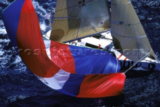 A racing yacht blows its spinnaker