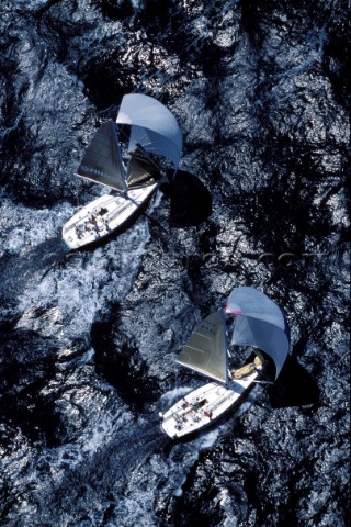 Aerial shot of two yachts sailing down wind under spinnaker