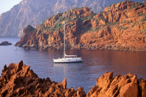 40ft cruising yacht at anchor in a secluded bay in Corsica in the Mediterranean