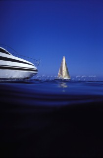 Power boat and sailing yacht in a calm sea - Mediterranean