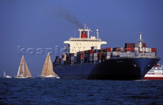 Container ship and sailing yachts in the Solent shipping channel