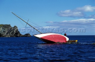 Sailing yacht stuck on rocks, Glandore Harbour, southern Ireland