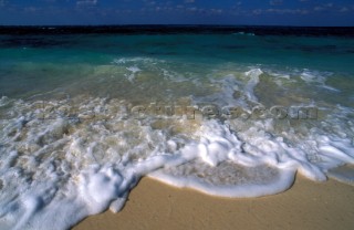 Close up of sea lapping sandy shore, Bahamas