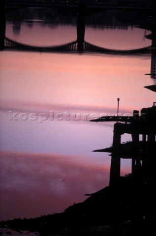 Reflection of Wandsworth Bridge at sunset in the river Thames London