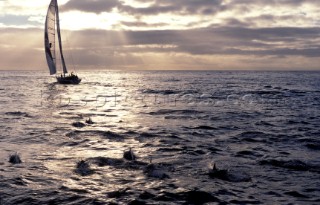 Sailing yacht on calm sea at sunset