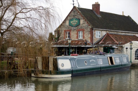 Canal boat moored outside public house pub  Canal boats on English Kennet and Avon Canals