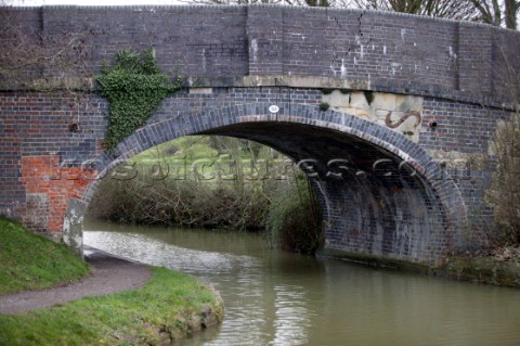 Road bridge over Kennet and Avon canal and river  Canal boats on English Kennet and Avon Canals