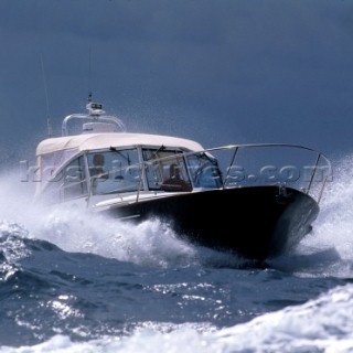 Lagacy motor powerboat in rough water