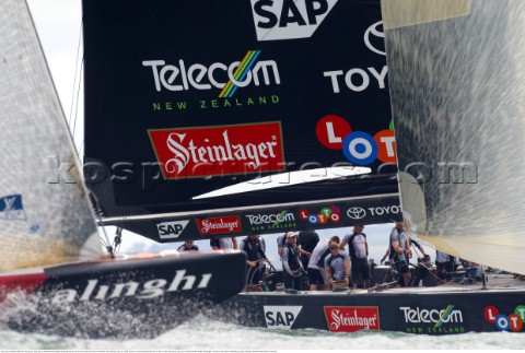 Team New Zealands NZL82 crew keep a close eye on Switzerlands Alinghi Challenge during race five the