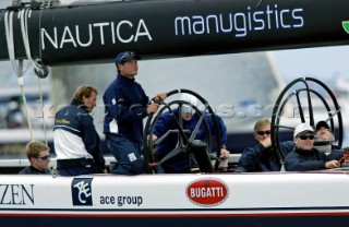 Former helmsman of Marcalzone Latino Paolo Cian at the helm of Team Dennis Conners Stars and Stripes  B-boat USA-66 during day one of the Louis Vuitton Cup, Quarter final repechage. Auckland, New Zealand. Nov, 23. 2002  (Photo credit: Sergio Dionisio/Kos Picture Source)