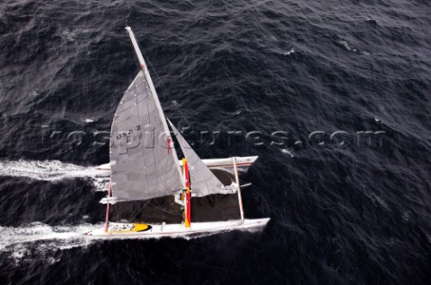 Maxi Cat Cheyenne owned by American Steve Fossett crosses the Finish after a record round the world 