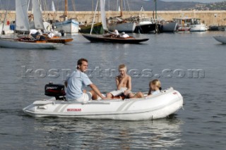 Dinghy with outboard engine and family