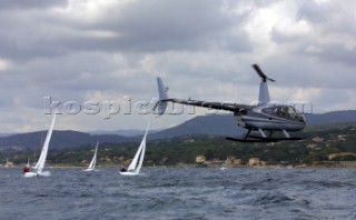 Helicopter filming flying too low near sailing yachts