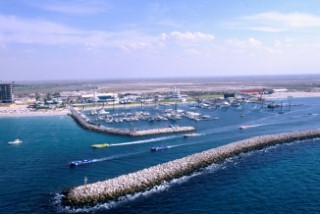 Power boats leaving harbour, Dubai - United Arab Emirates.
