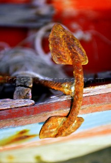 Rusty old anchor on fishing boat, Thailand