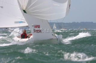Man in racing boat in rough seas