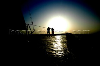 silhouettes of crew on bow of Cheyenne