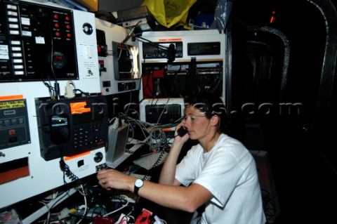 Claire Bailey at nav station during boat rewiring