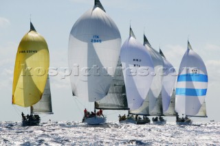Fleet of Swan yachts racing down wind under spinnaker