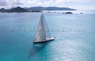 Luxury superyacht Red Dragon under sail in calm tropical seas of the Caribbean