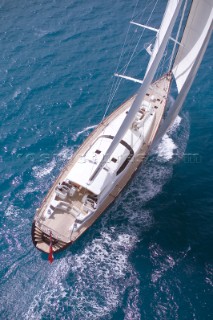 Aerial view of luxury superyacht Red Dragon under sail in calm tropical seas of the Caribbean