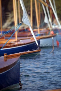 A line of Salcombe Yawls at their moorings