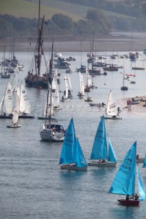 Enterprise and Laser dinghies sail in front of a Thames Barge during Salcombe Regatta Week 2005