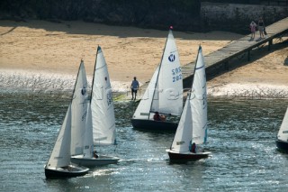 Dinghies sailing off beach in Salcombe, Devon
