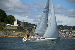 Cruising yacht sailing off the Devon coast