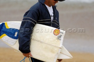 Competitor holds a broken surfboard at the Rip Curl Championship 2005