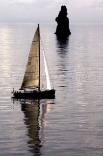 ATALANTA II sails passed Filicudi Island during the Rolex Middle Sea Race 2005