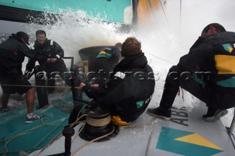 Extreme rough weather sailing shots onboard of the Volvo 70 ABN AMRO surfing downwind with wash wave