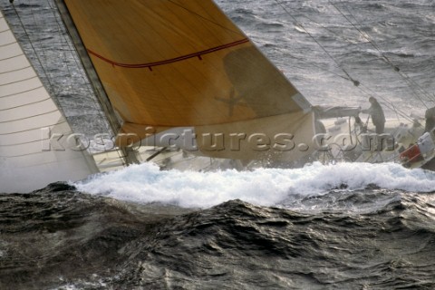 Yacht in large waves and rough sea