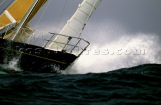 Yacht in large waves and rough sea