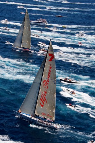 Wild Oats  sail against Alfa Romeo at the start of the Rolex Sydney to Hobart Race on Boxing Day in 