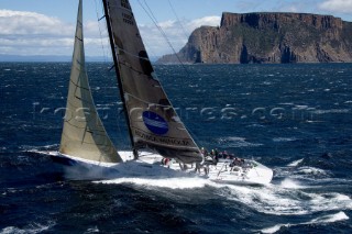 Konica Minolta sailing along the Tasmanian coast, Australia,Dec. 28, 2005. 85 yachts of all sizes battled for this years line honors in this the 61st running of the world famous race.